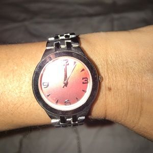 Silver watch with red ombré face.